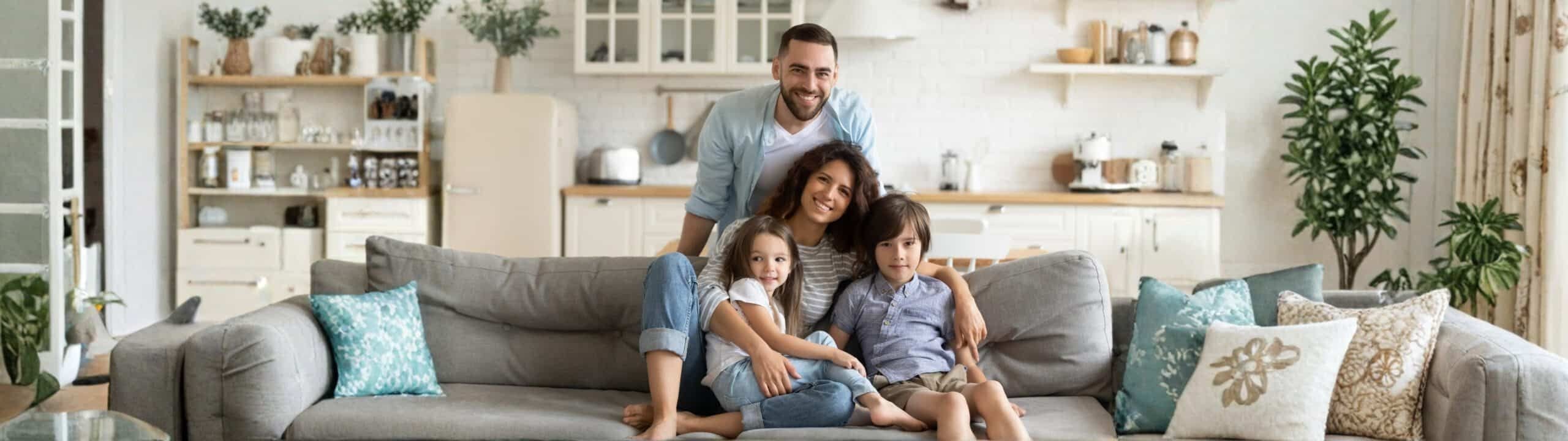 A family relaxing together at home in their living room